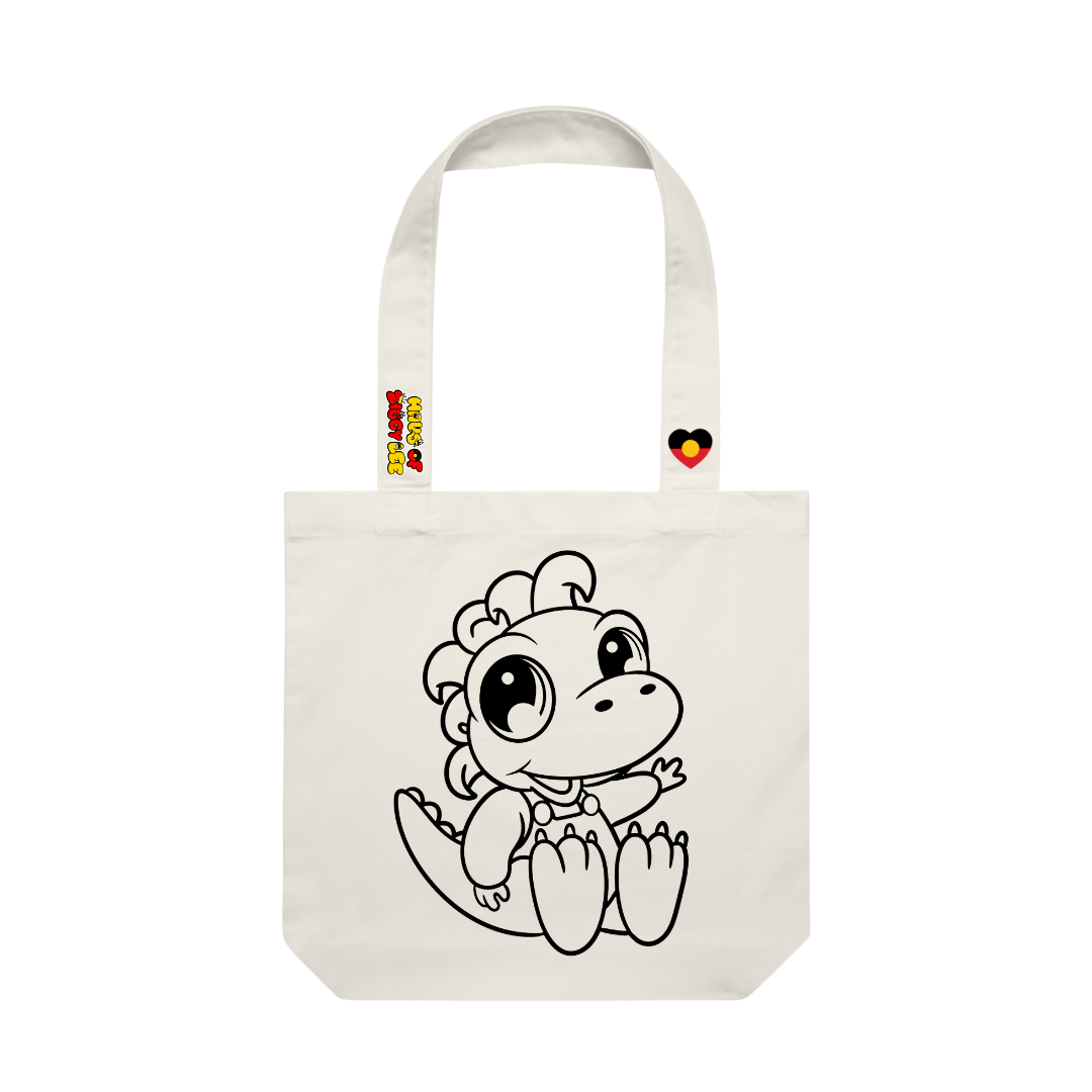haus of ziggy lee canvas colour in tote bag with a ziggysaurus cartoon dinosaur design black outline to fill in. haus of ziggy lee logo and aboriginal flag heart decals on strap.