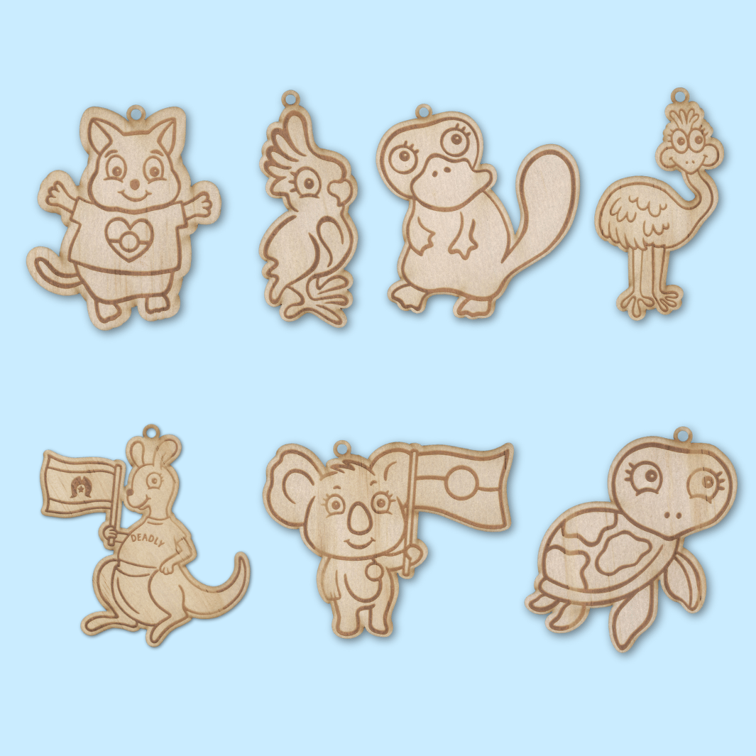 set of 7 wooden haus of ziggy lee haus of dizzy native animal colour in keychains on a light blue background