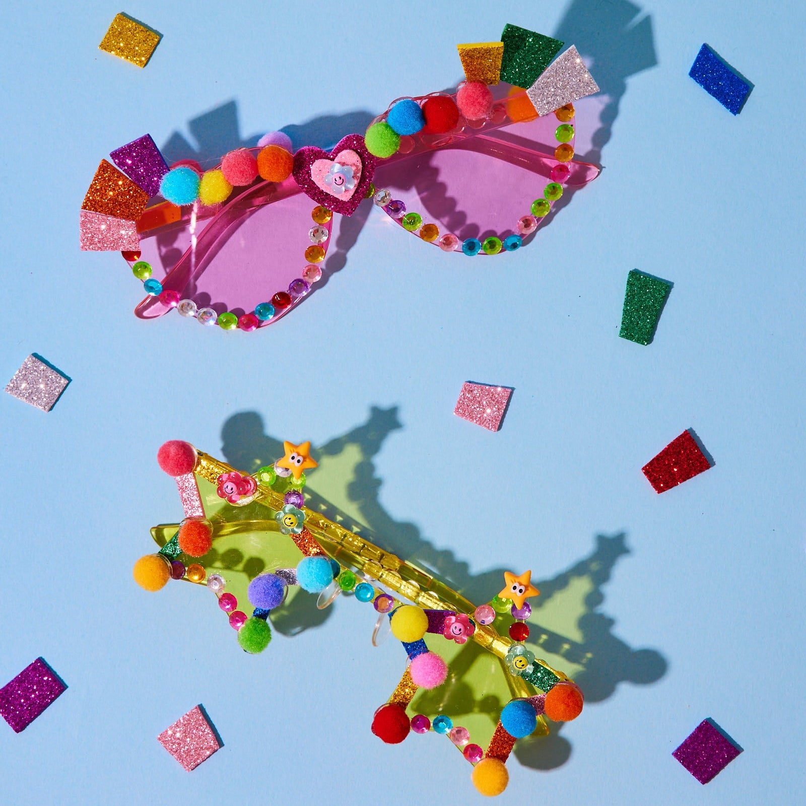 see make play colorful sunglasses with decorative elements on a blue background