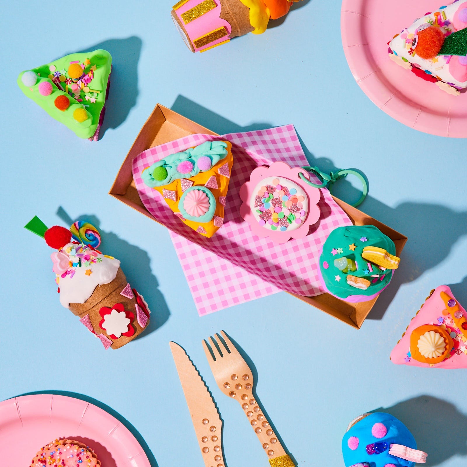 see make play children's diy dessert tray craft kit including paper mache plates and decorative items on a blue background