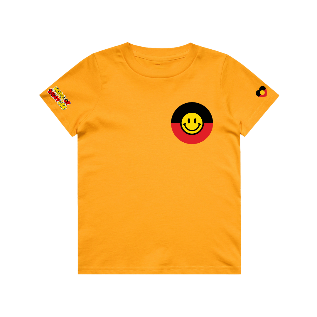 haus of ziggy lee yellow t shirt with decals on sleeve and circle aboriginal flag on chest with smiley ace in centre of yellow sun part