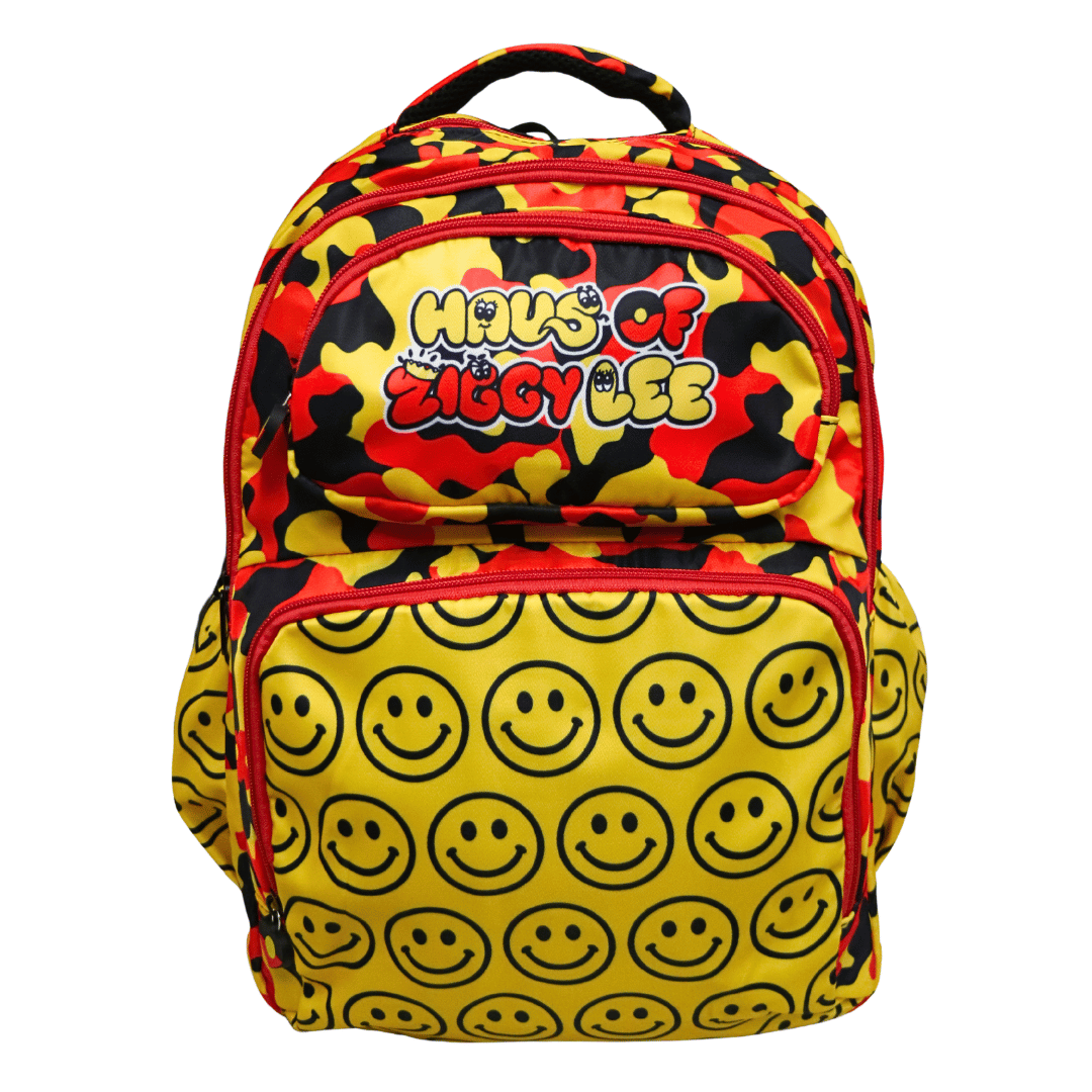 black, yellow, and red camouflage backpack with a large yellow front pocket covered in black smiley faces, featuring the 'Haus of Ziggy Lee' logo on the top compartment - front view