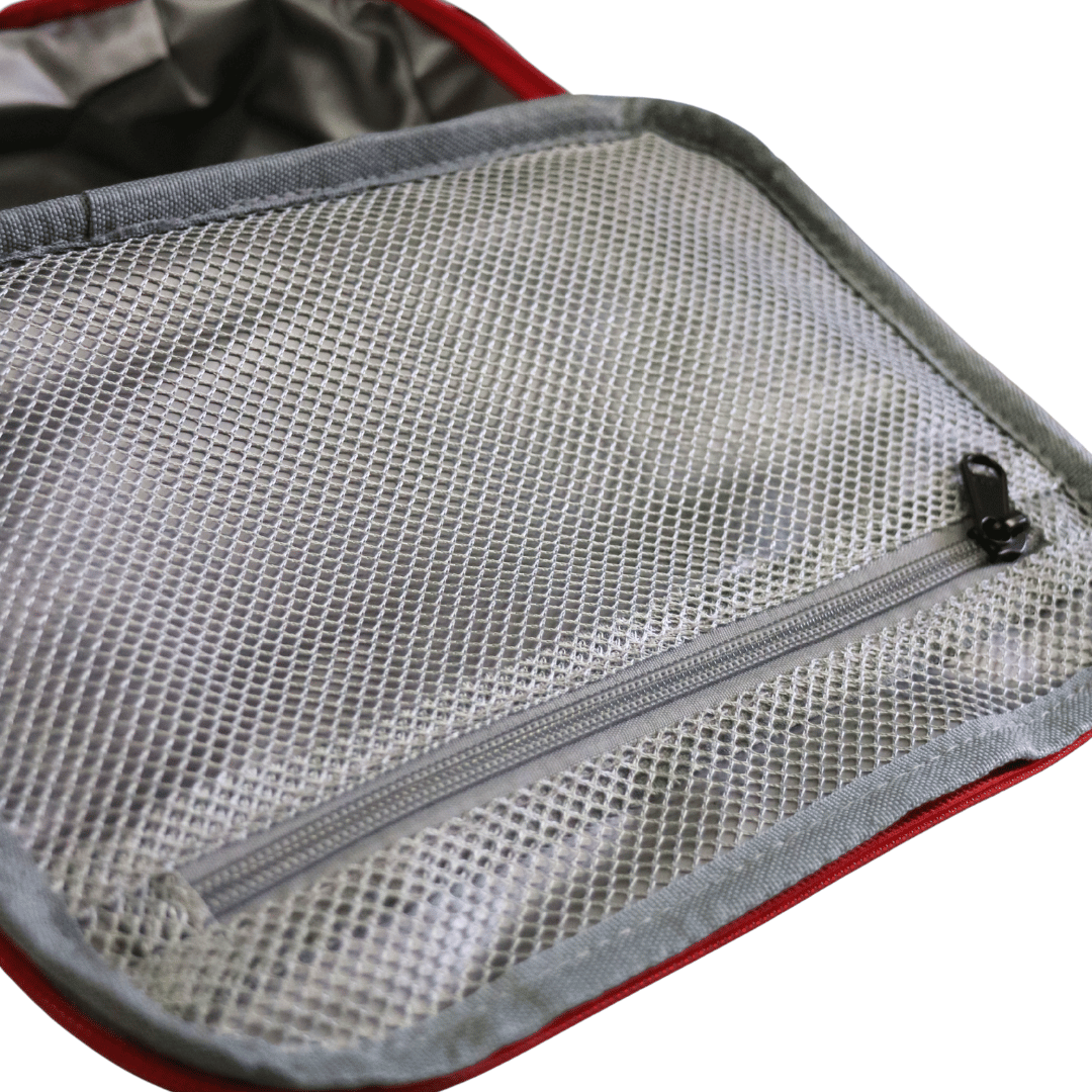 Close-up of a gray mesh zippered compartment in insulated lunch bag with a red fabric border