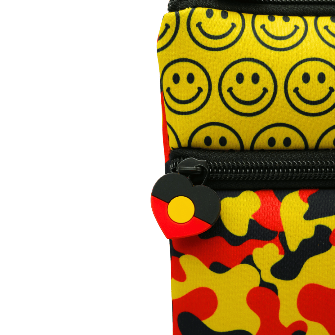 haus of ziggy lee everyday deadly pencil case close up shot of custom Aboriginal flag heart PVC zipper pull